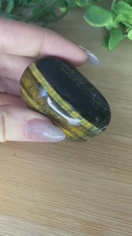 Load and play video in Gallery viewer, Tiger&#39;s Eye Palm Stone
